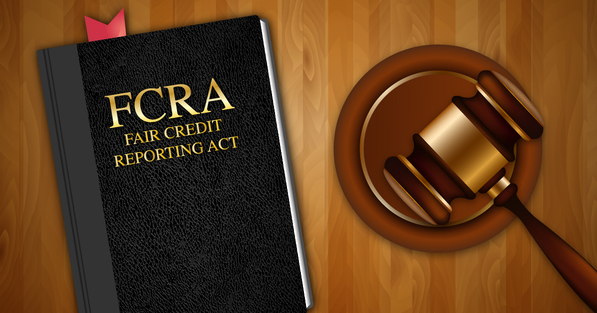 FCRA book titled "Fair Credit Reporting Act" alongside a gavel on a wooden surface, representing legal guidelines for background checks and DUI record lookups.